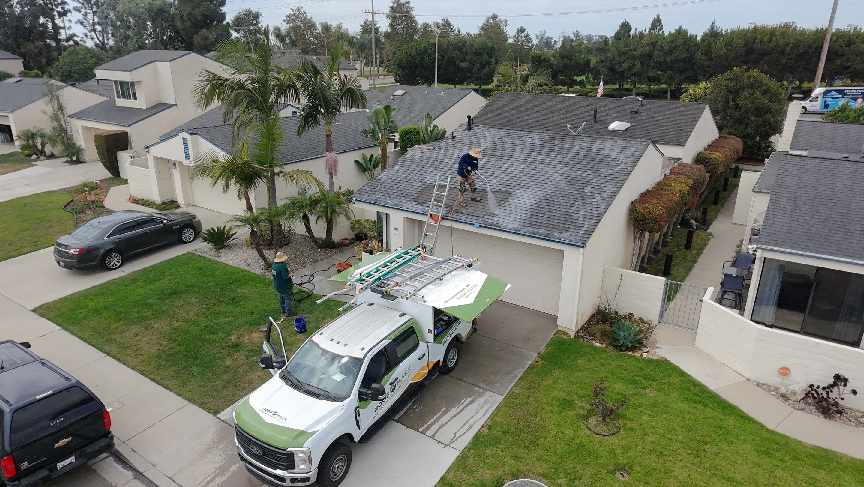Crew members standing on a Ventura roof.