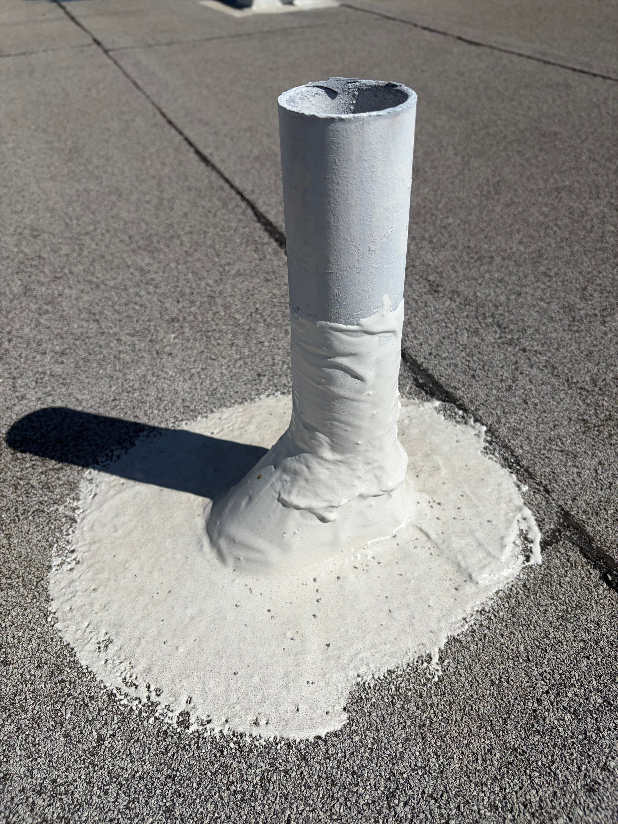 A pipe penetration sealed and reinforced before the field coat.