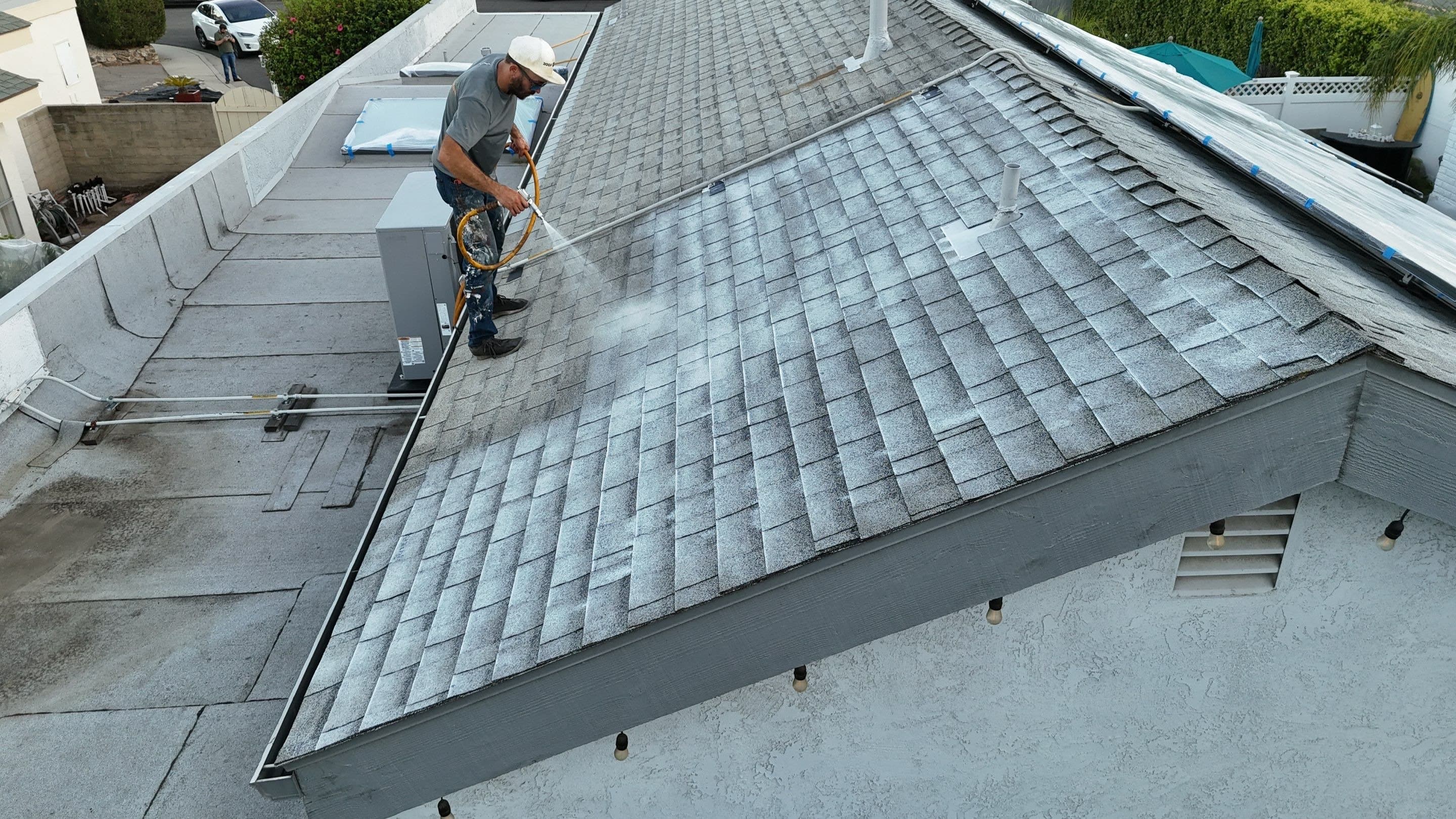 A crew working the eave course of a Thousand Oaks roof.