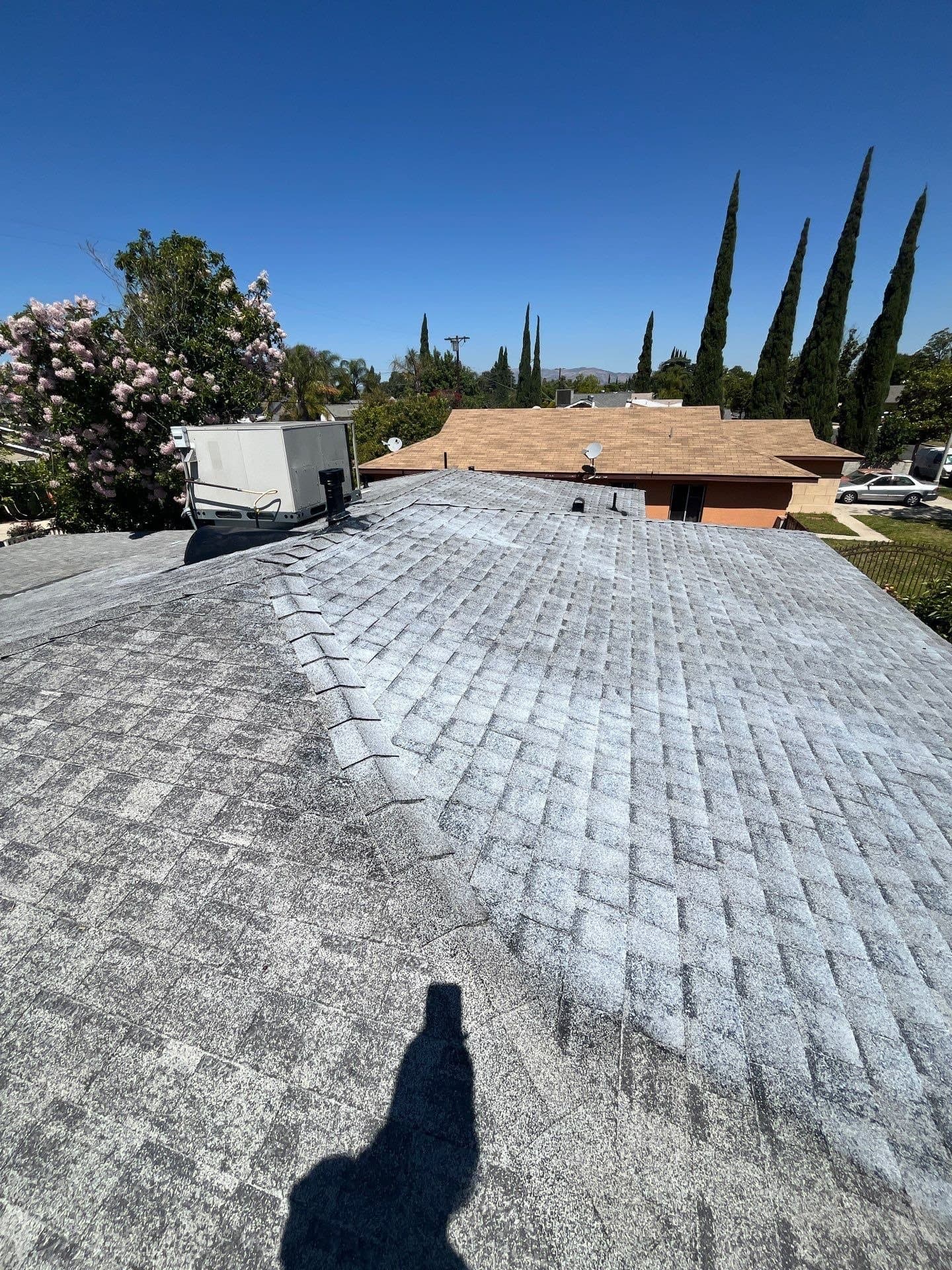 A crew on a treatment pass down the slope of a home in Pacoima, Los Angeles.
