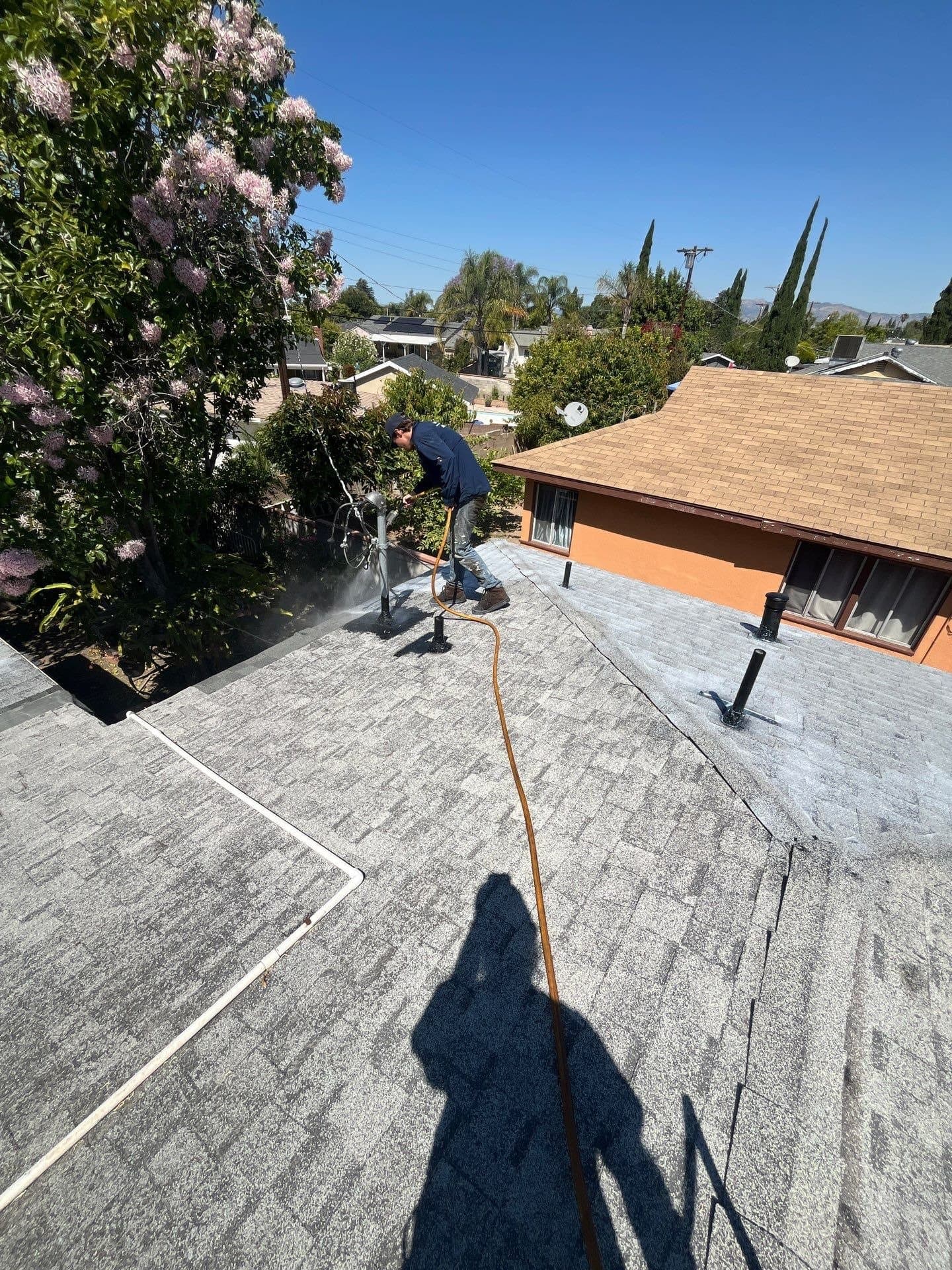 The ridge of a roof in Pacoima, Los Angeles, seen from the eave during treatment.