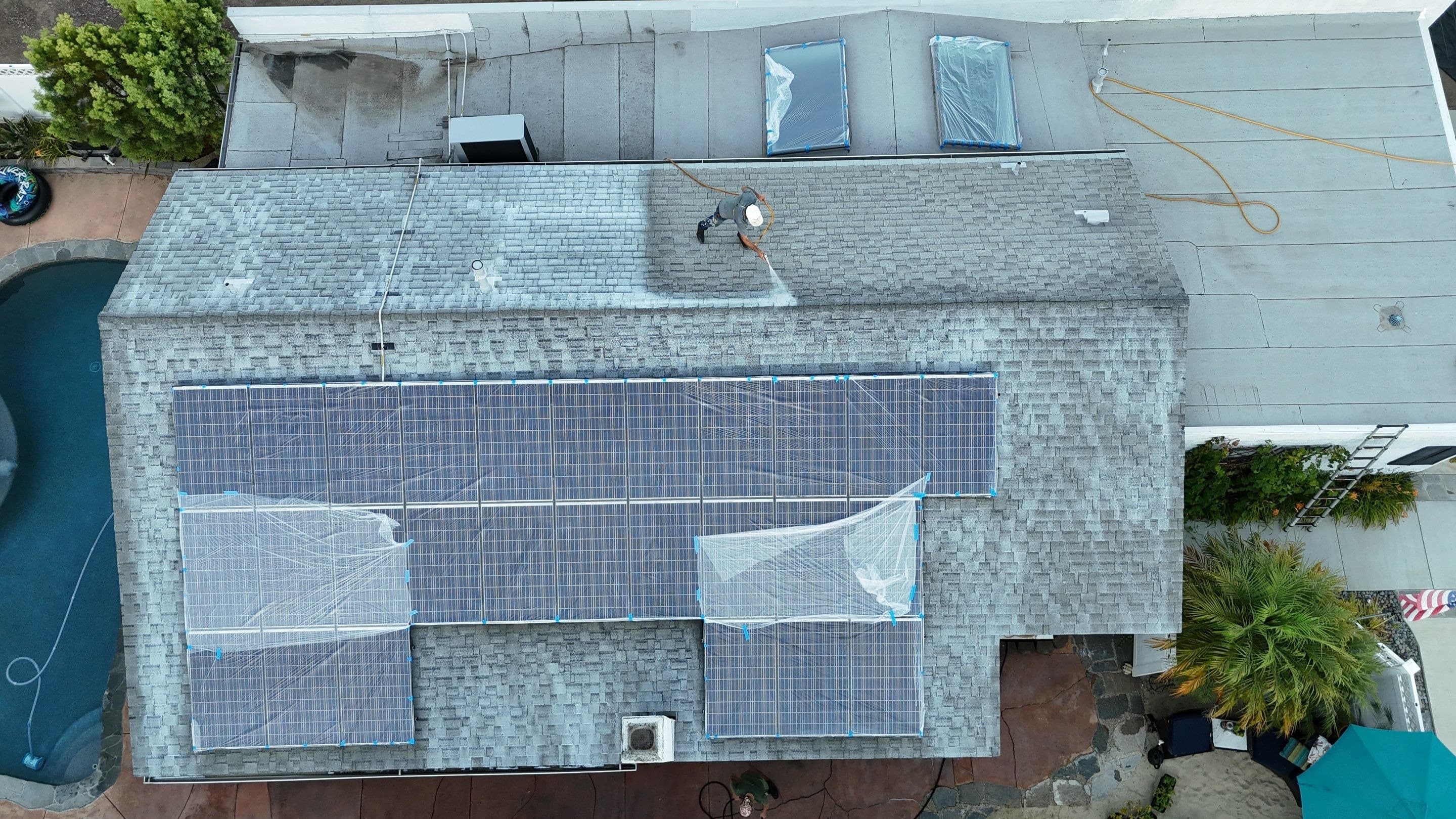 Overhead view of a Thousand Oaks roof with the solar arrays covered in plastic sheeting.